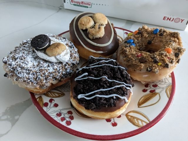 A 3/4 view of Krispy Kreme's Oreo and Chips Ahoy! Cookie Blast Donuts