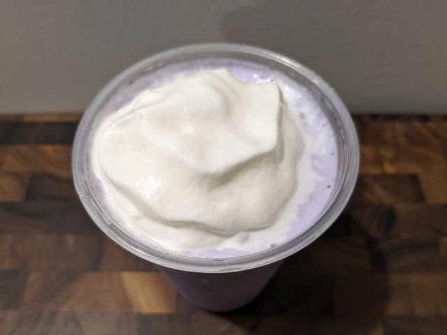McDonald's Grimace's Birthday Shake top-down view with lid removed.