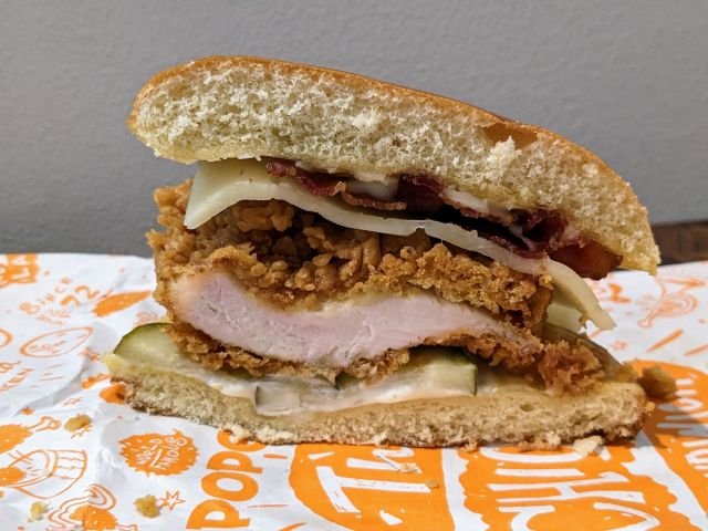 Popeyes Classic Bacon & Cheese Chicken Sandwich cross-section.