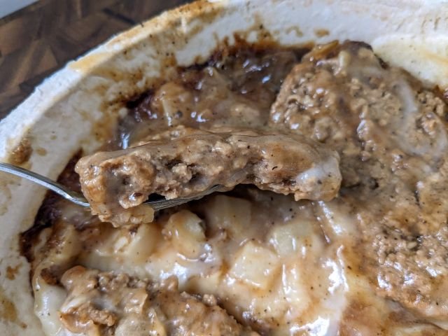 Hungry-Man Smothered Salisbury Steak Double Meat Bowl cross-section of patty.