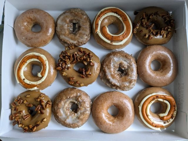 2023 Krispy Kreme Pumpkin Spice Donuts dozen top-down view.