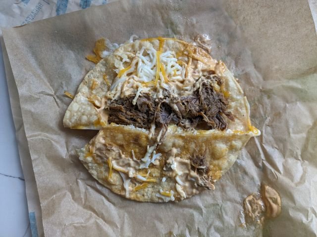 Taco Bell Grilled Cheese Dipping Taco opened up.